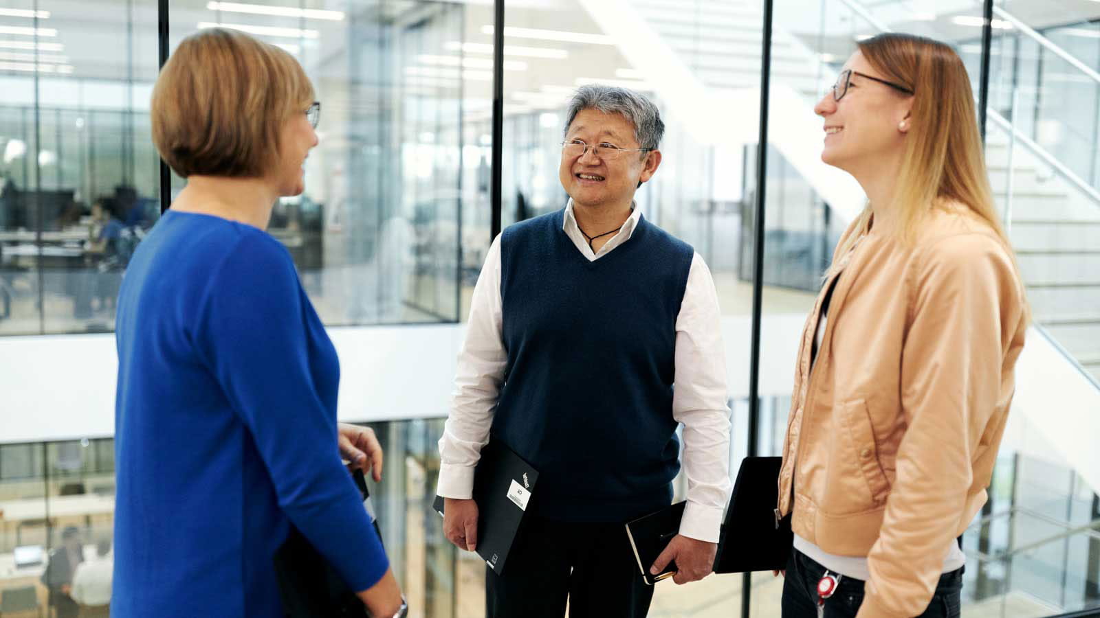 CSL-Employees-in-Hallway-Bern-REV