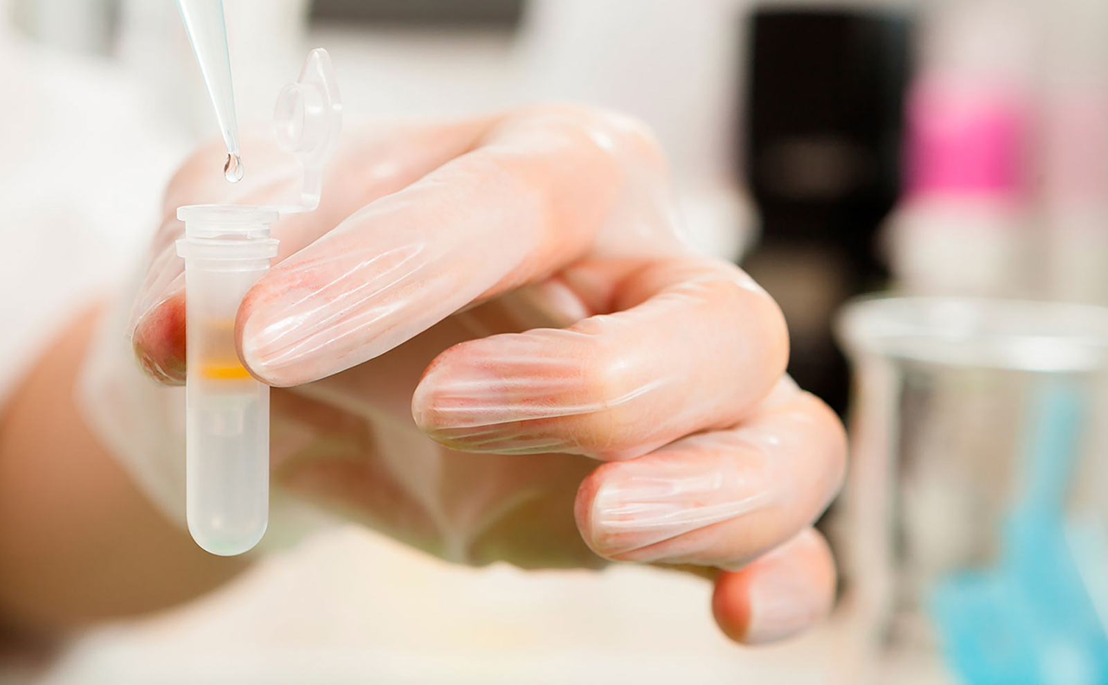 Hand holding pipette